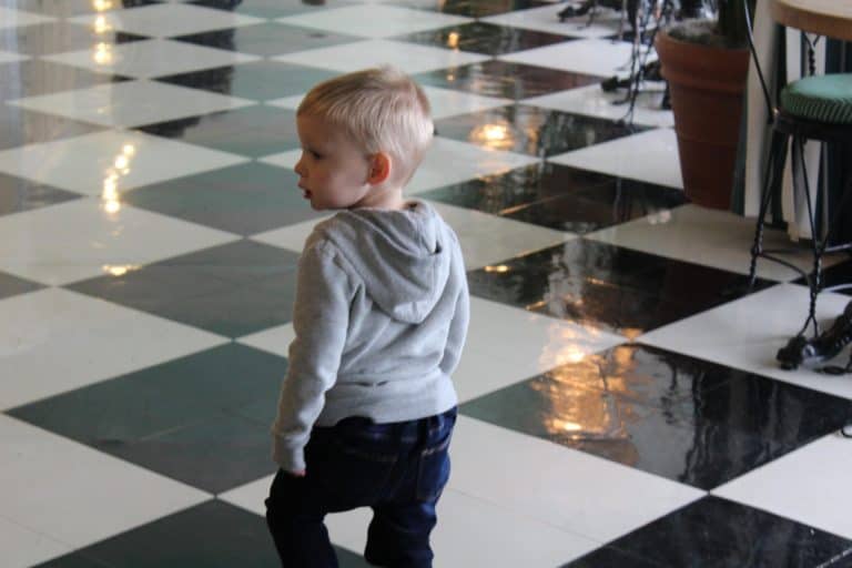 Little boy walking through the Grand Hotel on Mackinac Island
