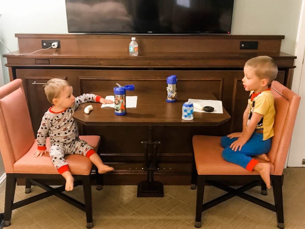 Brothers eating breakfast in the room at a Disney World resort after grocery delivery at Disney World