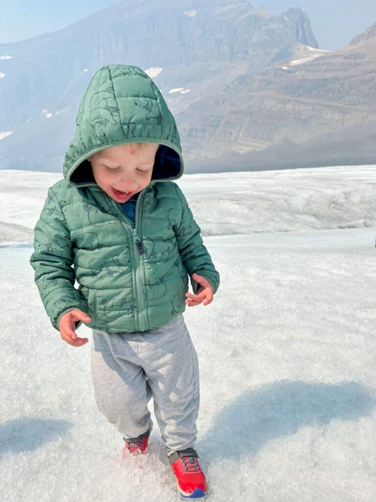 Toddler walking on the Athabasca Glacier